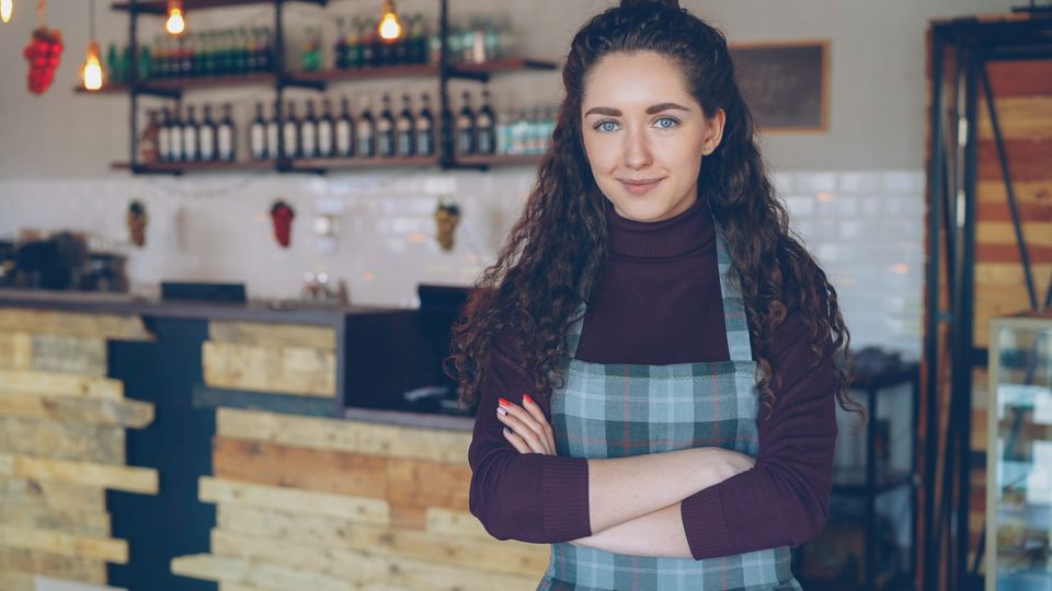 Cafe owner in a cozy coffee shop